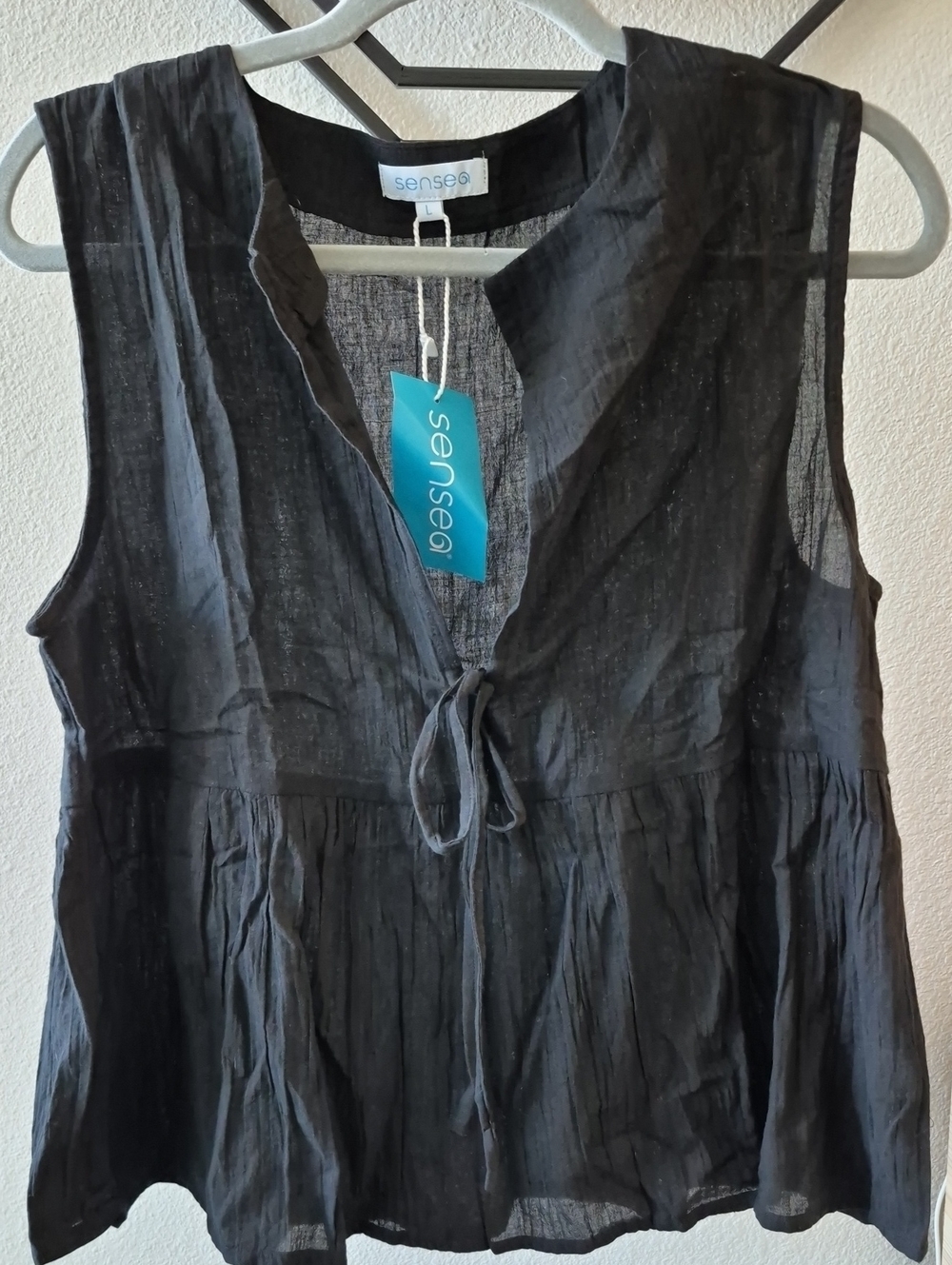Black Sleeveless Tie-Front Peplum Top